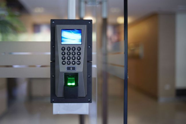 Biometric keypad reader on a glass office door